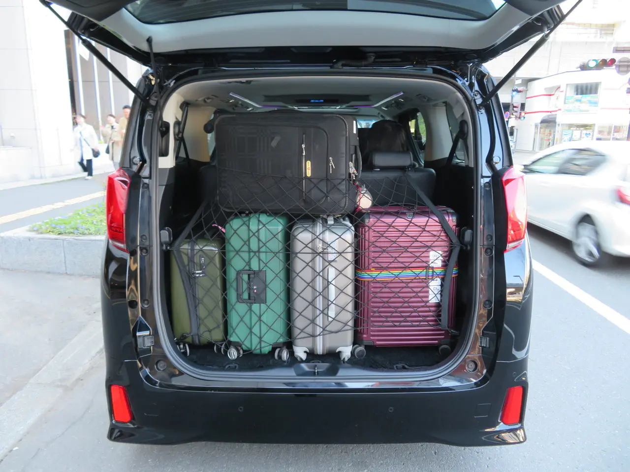 Image of easily loading luggage into a taxi at the airport for a comfortable journey